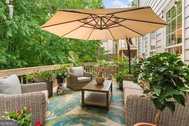 balcony featuring outdoor lounge area and a patio