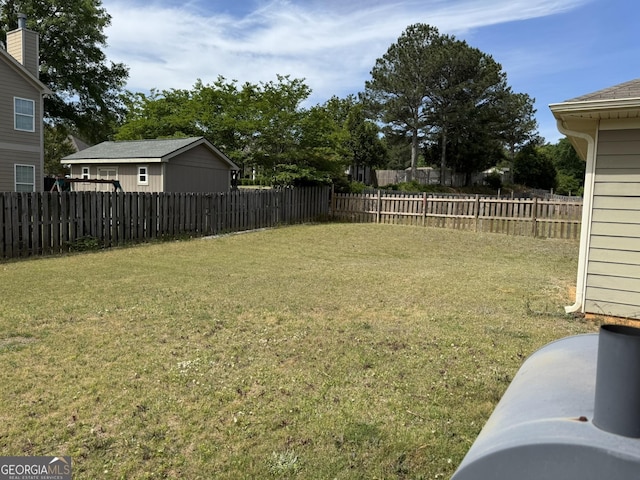 view of yard with a fenced backyard