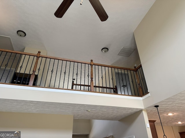details featuring a textured ceiling and ceiling fan