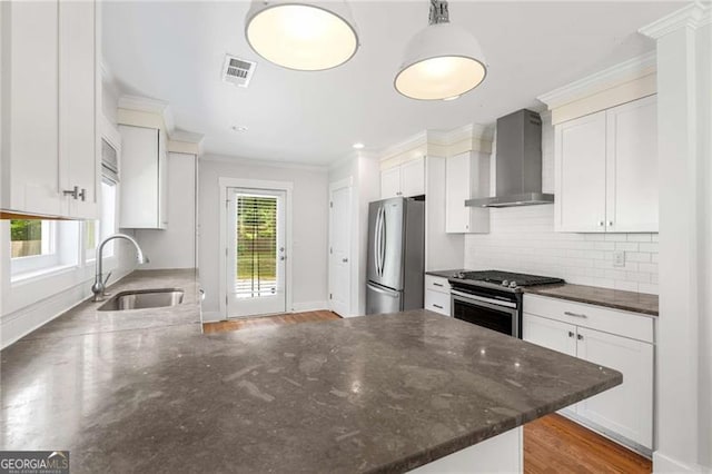 1798 S Gordon St SW, Atlanta, GA 30310 - kitchen with a sink, wall chimney range hood, ornamental molding, visible vents, and appliances with stainless steel finishes