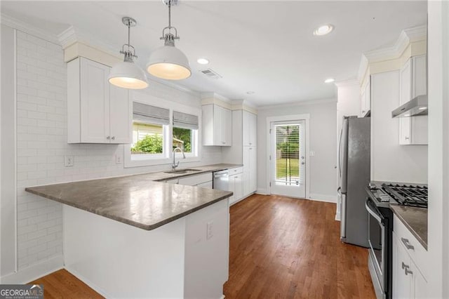 1798 S Gordon St SW, Atlanta, GA 30310 - kitchen with a sink, ornamental molding, under cabinet range hood, white cabinetry, and appliances with stainless steel finishes