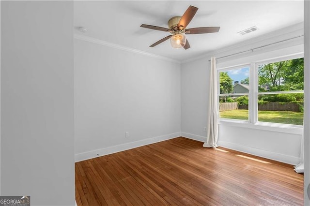 1798 S Gordon St SW, Atlanta, GA 30310 - unfurnished room with crown molding, baseboards, visible vents, and wood finished floors