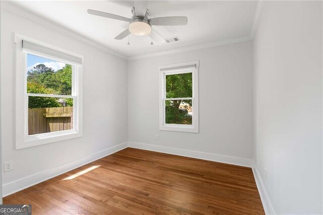 1798 S Gordon St SW, Atlanta, GA 30310 - unfurnished room featuring ornamental molding, baseboards, plenty of natural light, and wood finished floors