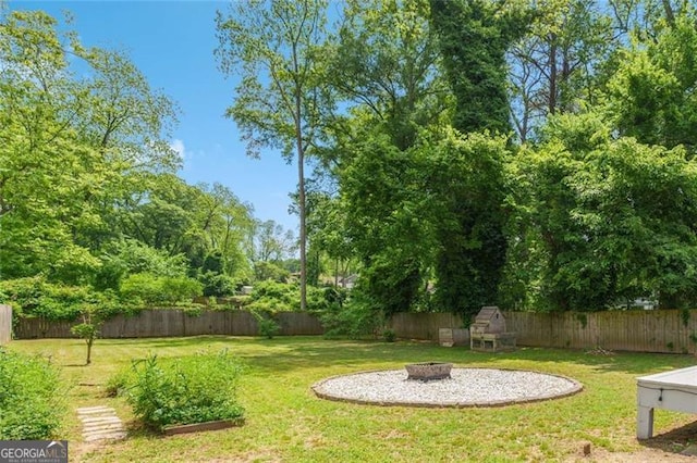 1798 S Gordon St SW, Atlanta, GA 30310 - view of yard featuring a fenced backyard and an outdoor fire pit