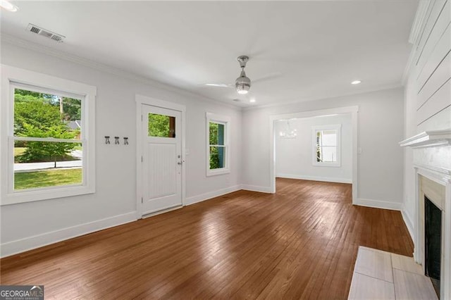 1798 S Gordon St SW, Atlanta, GA 30310 - unfurnished living room featuring ceiling fan, a wealth of natural light, wood-type flooring, and visible vents