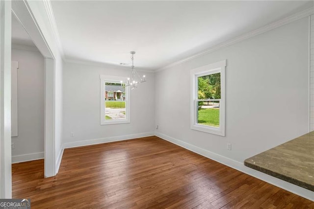 1798 S Gordon St SW, Atlanta, GA 30310 - unfurnished dining area featuring baseboards, crown molding, a chandelier, and wood-type flooring