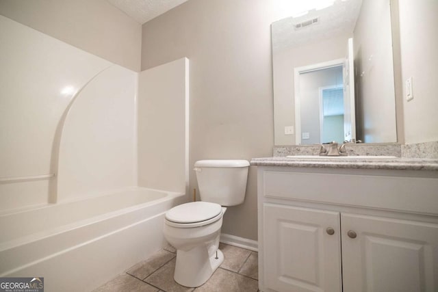 bathroom featuring vanity, visible vents, toilet, baseboards, and tile patterned floors