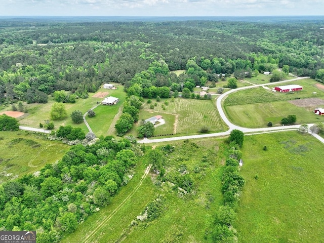aerial view with a view of trees and a rural view