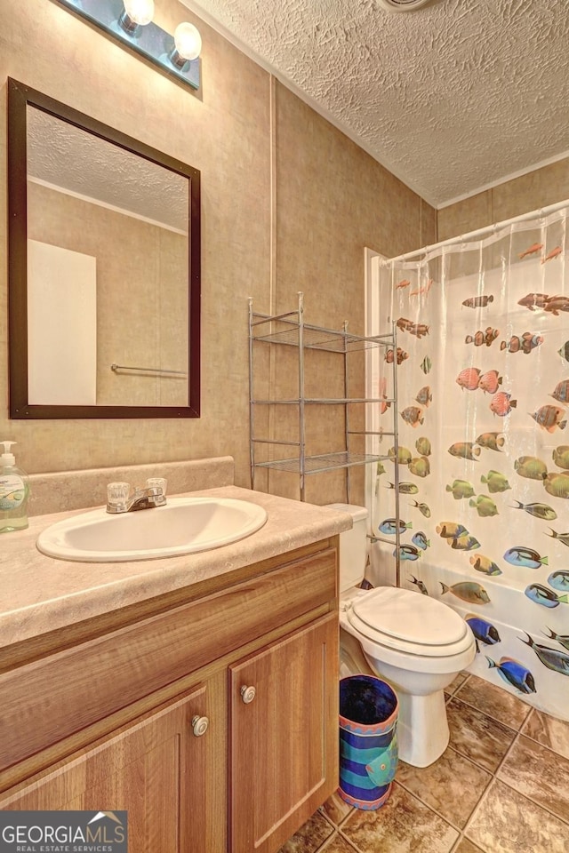 full bath featuring a textured ceiling, tile patterned floors, and vanity