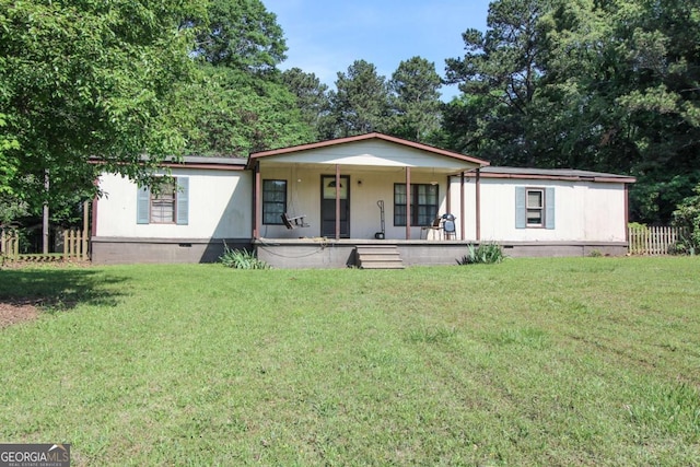 manufactured / mobile home with a porch, fence, a front yard, and crawl space