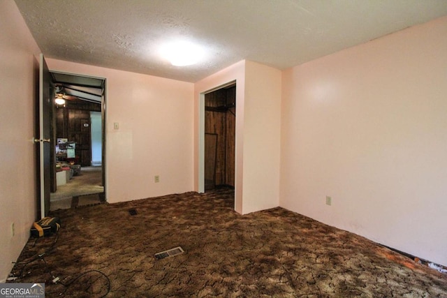 unfurnished bedroom with visible vents and carpet