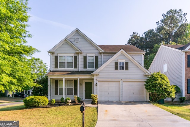 312 Burdock Trce, Woodstock, GA 30188 - view of front facade with an attached garage, concrete driveway, a porch, and a front yard