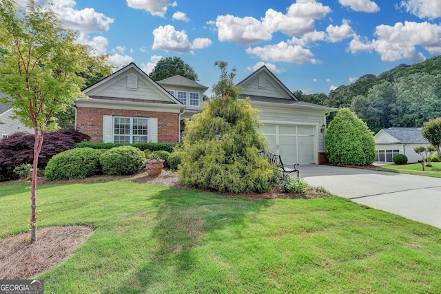 view of front of property featuring brick siding, a front lawn, an attached garage, and driveway
