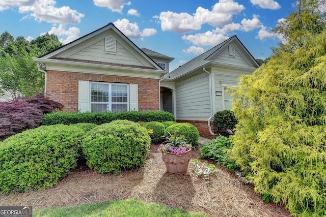 ranch-style house with brick siding