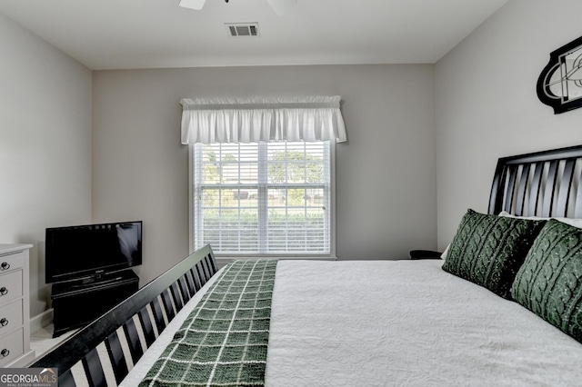 bedroom featuring a ceiling fan and visible vents