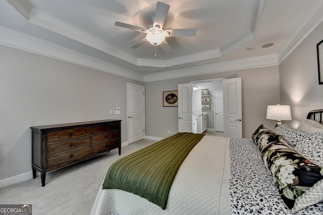 bedroom featuring a ceiling fan, crown molding, a raised ceiling, baseboards, and light carpet