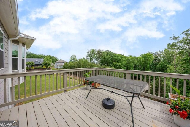 deck featuring a lawn
