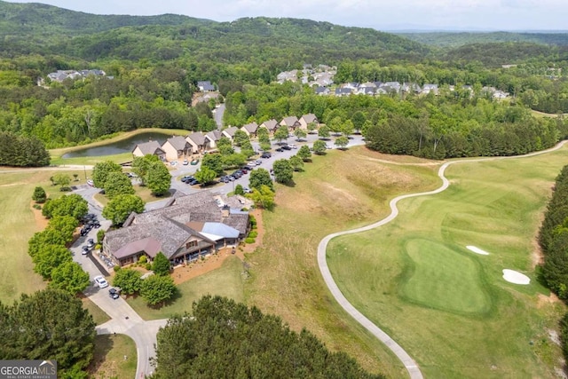 bird's eye view with view of golf course, a residential view, and a forest view