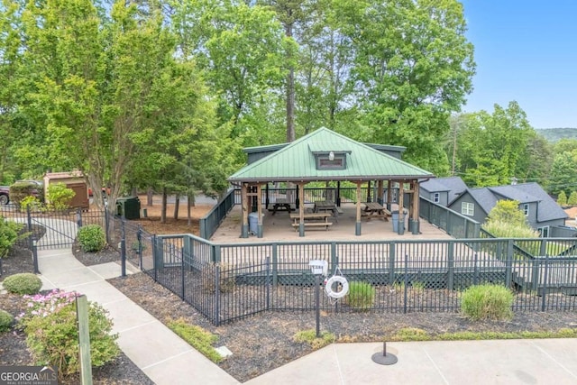 view of community featuring a gazebo and fence