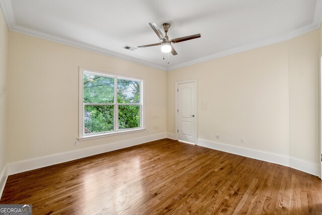 1303 N Druid Hills Rd, Brookhaven, GA 30319 - spare room with visible vents, ornamental molding, wood finished floors, baseboards, and ceiling fan