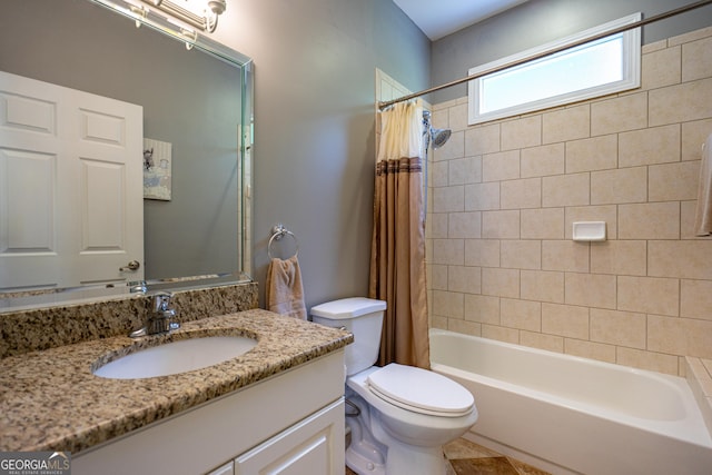 full bath featuring toilet, shower / bath combination with curtain, and vanity