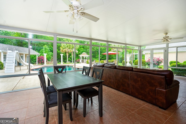 sunroom / solarium featuring tile patterned floors