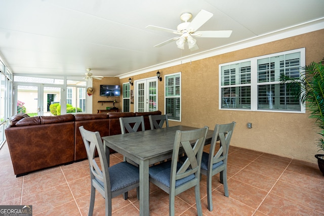 dining room with french doors, a ceiling fan, and light tile patterned flooring