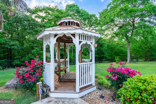 exterior space with a gazebo and fence