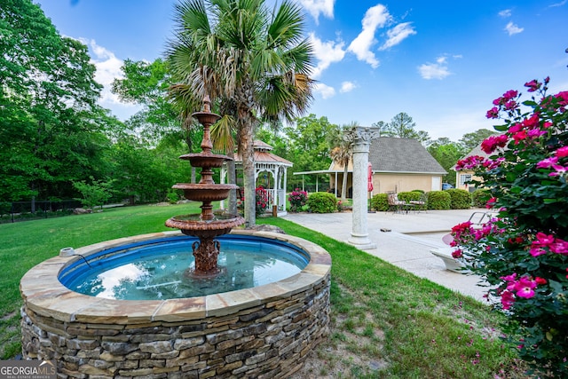 exterior space with a gazebo, a lawn, and a patio