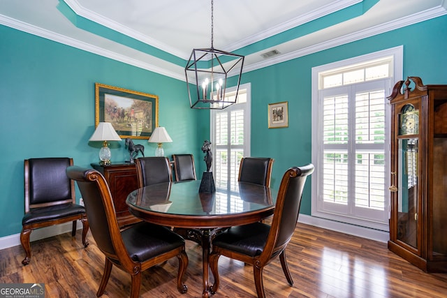 dining space featuring an inviting chandelier, dark wood finished floors, and a healthy amount of sunlight