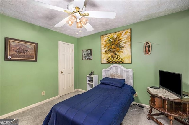 carpeted bedroom with baseboards, a textured ceiling, and ceiling fan