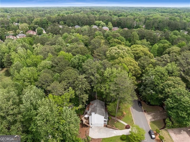 bird's eye view featuring a forest view