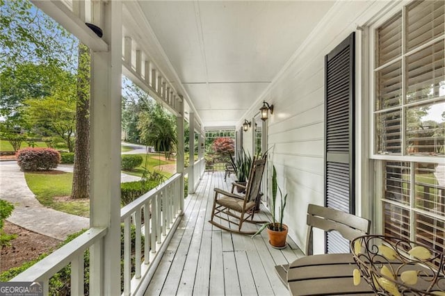 wooden deck featuring a porch