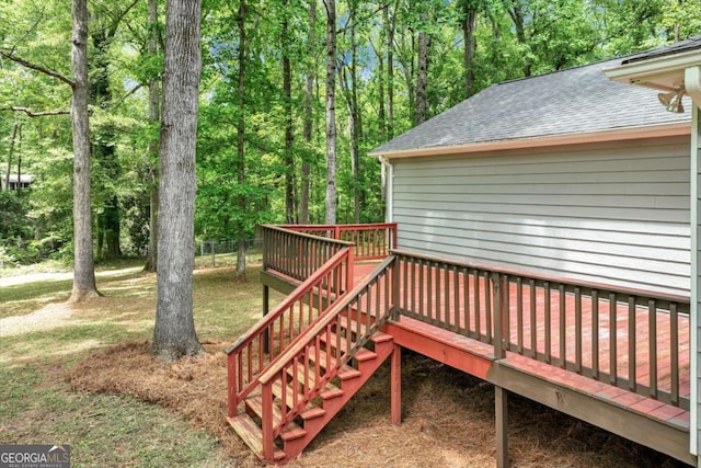 wooden deck with stairs and a yard