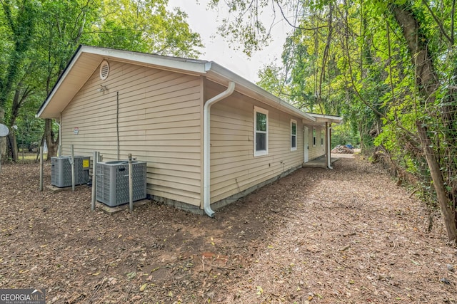 view of side of property with cooling unit