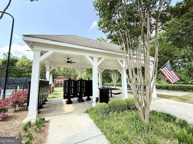 view of property's community featuring a gazebo, fence, and mail area