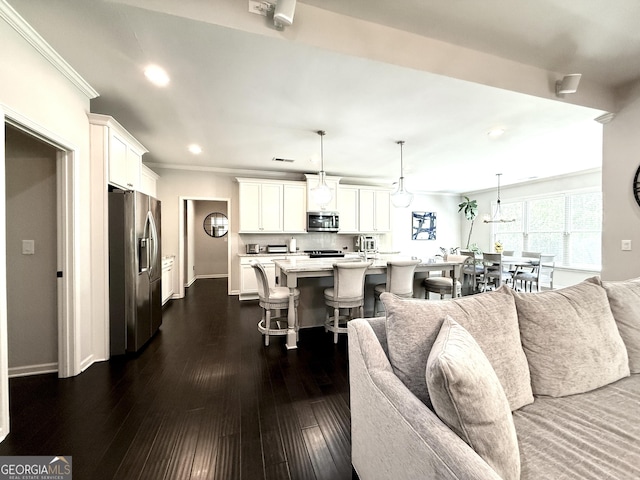 living room with crown molding, visible vents, baseboards, dark wood-style floors, and recessed lighting