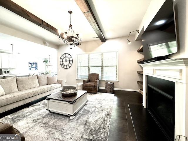 420 Manor Ridge Vw, Alpharetta, GA 30004 - living room with a chandelier, wood finished floors, beamed ceiling, baseboards, and a fireplace with raised hearth