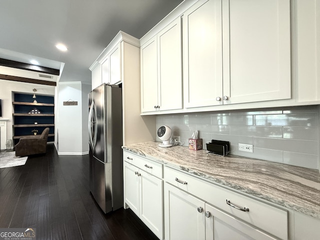 420 Manor Ridge Vw, Alpharetta, GA 30004 - kitchen with freestanding refrigerator, white cabinetry, light stone countertops, decorative backsplash, and dark wood finished floors
