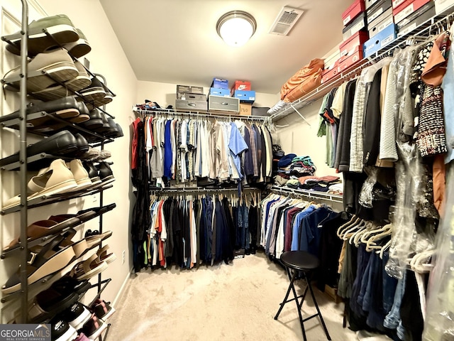 spacious closet with carpet floors and visible vents