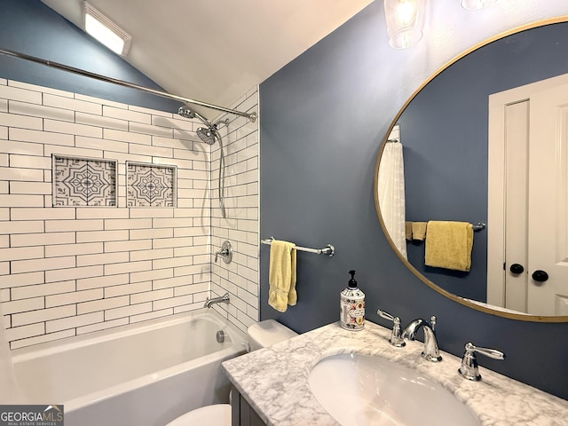 bathroom with vanity,  shower combination, lofted ceiling, and toilet