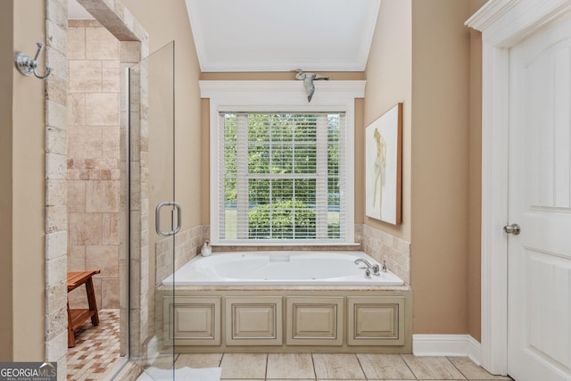 bathroom with ornamental molding, plenty of natural light, a shower stall, and a bath