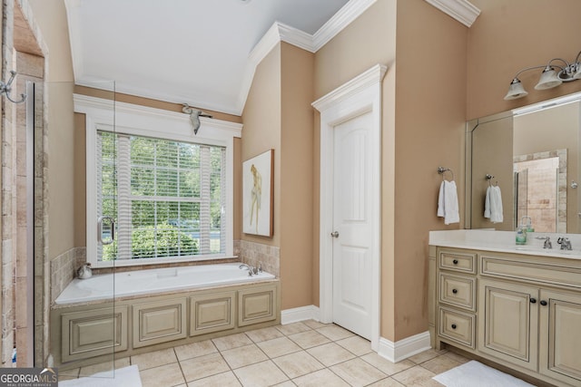 bathroom featuring crown molding, a garden tub, vanity, baseboards, and tile patterned floors