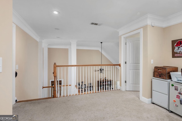 hall with ornamental molding, carpet flooring, and visible vents