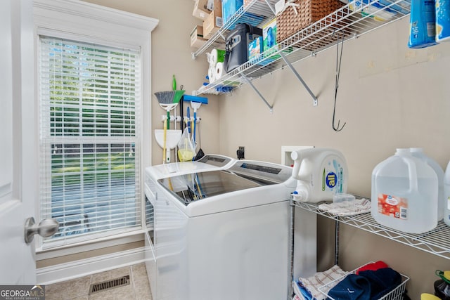 laundry room with laundry area, independent washer and dryer, tile patterned floors, and visible vents