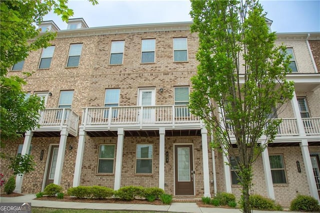 view of front of house featuring brick siding