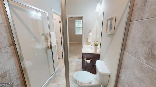 bathroom with toilet, a stall shower, vanity, and tile patterned flooring