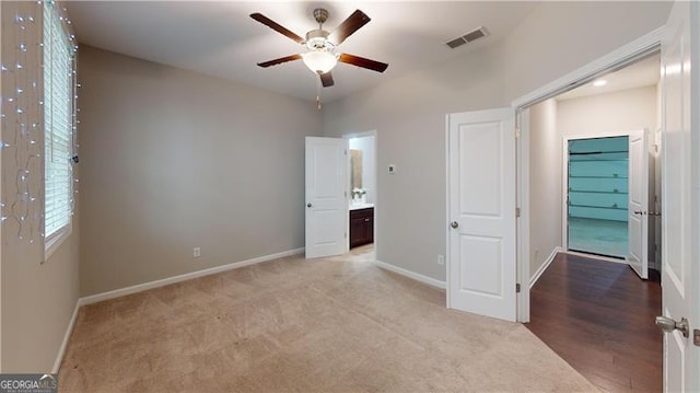 unfurnished bedroom featuring baseboards and carpet floors