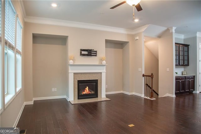 753 Topsail Ln, Alpharetta, GA 30005 - unfurnished living room featuring dark wood-type flooring, ceiling fan, a glass covered fireplace, and crown molding