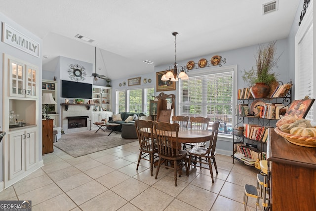 dining area featuring light tile patterned floors, visible vents, and a healthy amount of sunlight